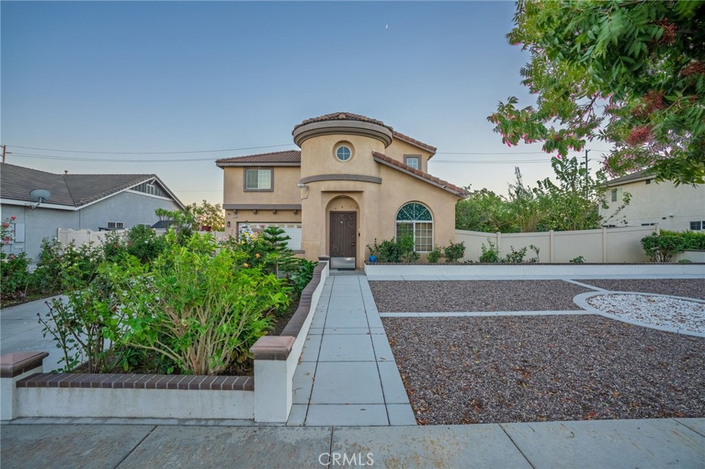 1553 West Ceres Street Rialto, CA 92376 - Photo 73 of 73 a front view of a house with a garden