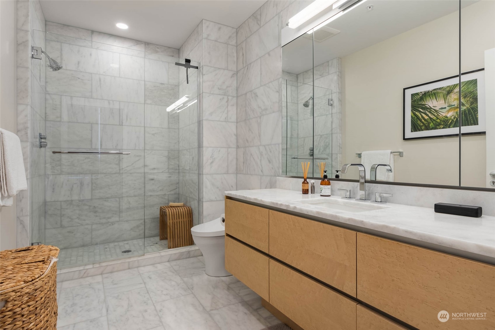 121 Stewart Street, Unit 3501 Seattle, WA 98101 - Photo 12 of 21 a bathroom with a double vanity sink mirror and shower