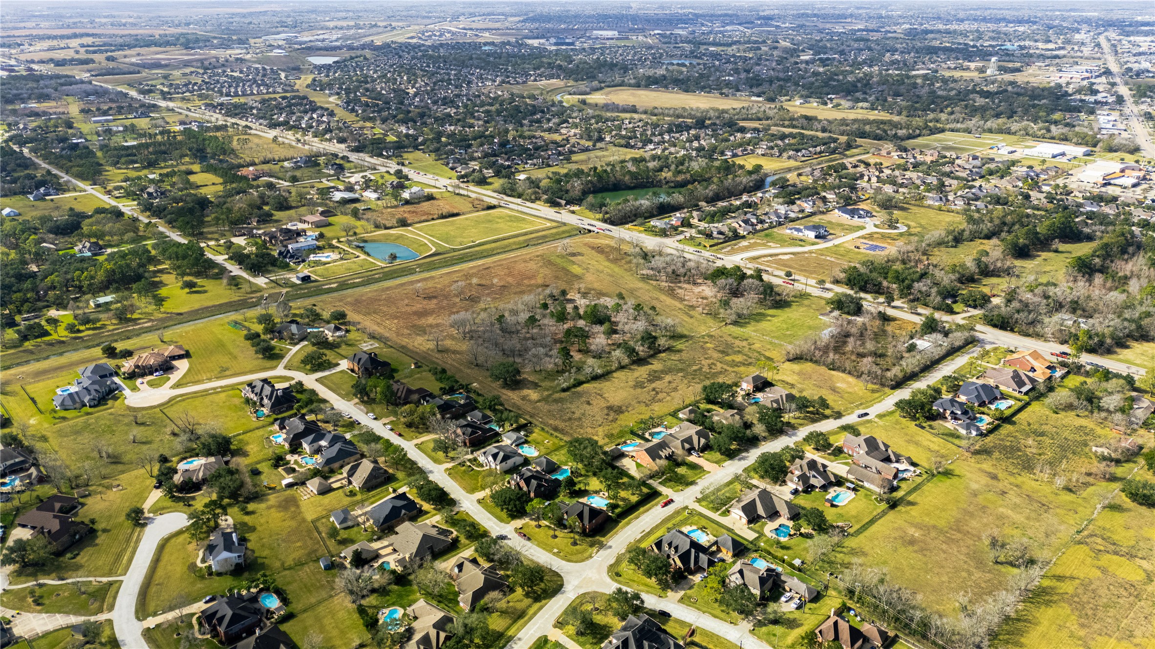 0 Dixie Farm Road Pearland, TX 77581 - Photo 8 of 11 an aerial view of residential houses with outdoor space