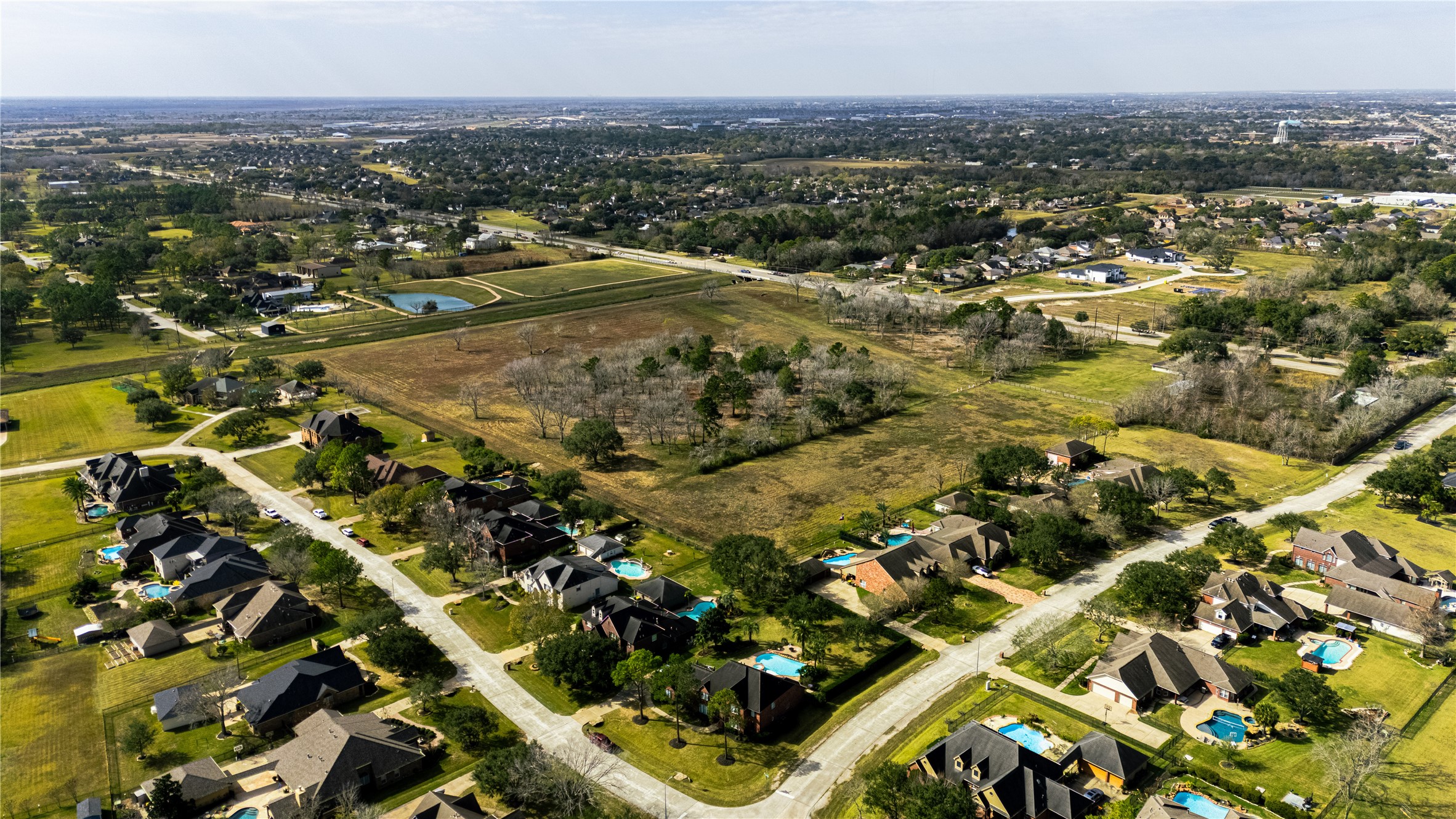 0 Dixie Farm Road Pearland, TX 77581 - Photo 9 of 11 an aerial view of residential houses with outdoor space