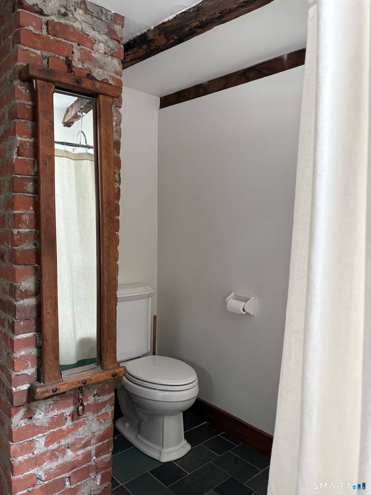 895 Tolland Stage Road Tolland, CT 06084 - Photo 12 of 33 a white toilet sitting next to a bathroom sink