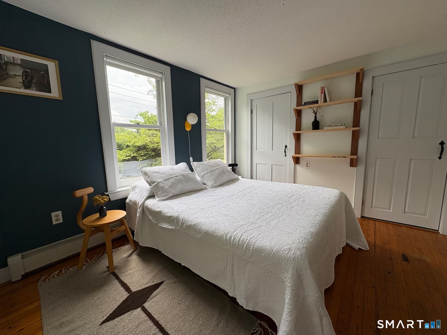 895 Tolland Stage Road Tolland, CT 06084 - Photo 14 of 33 a bedroom with a bed and a window