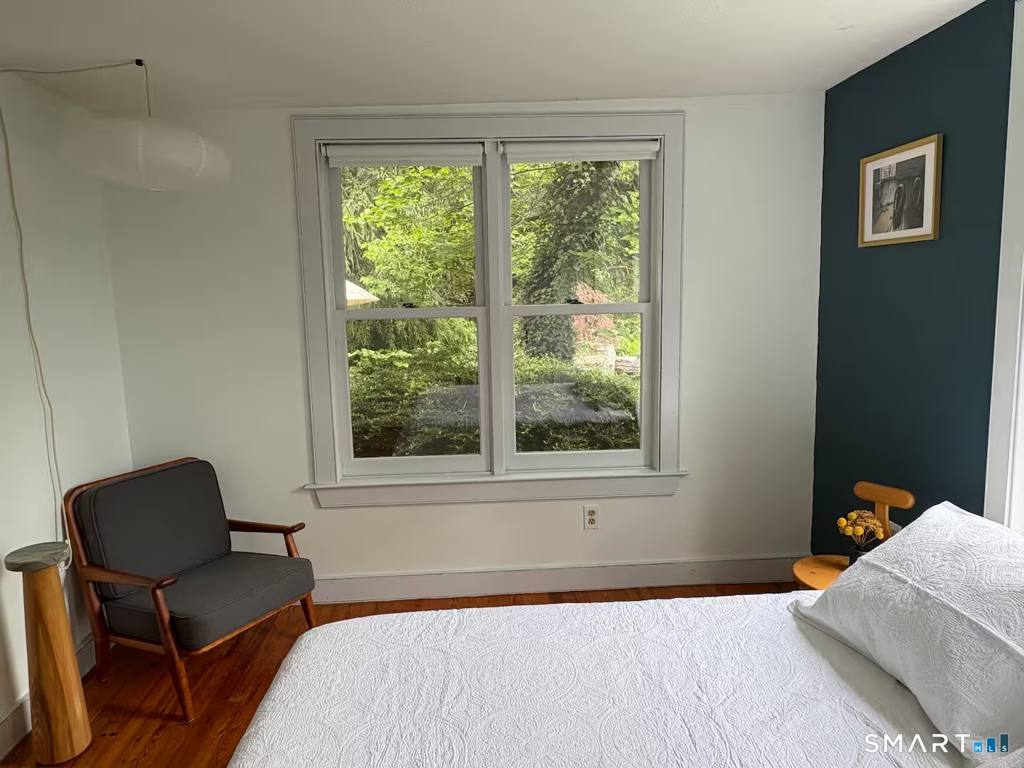 895 Tolland Stage Road Tolland, CT 06084 - Photo 15 of 33 a bedroom with a bed and a chair