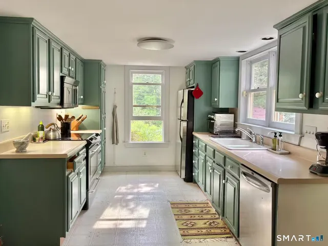 a bathroom with a sink double vanity granite and a mirror