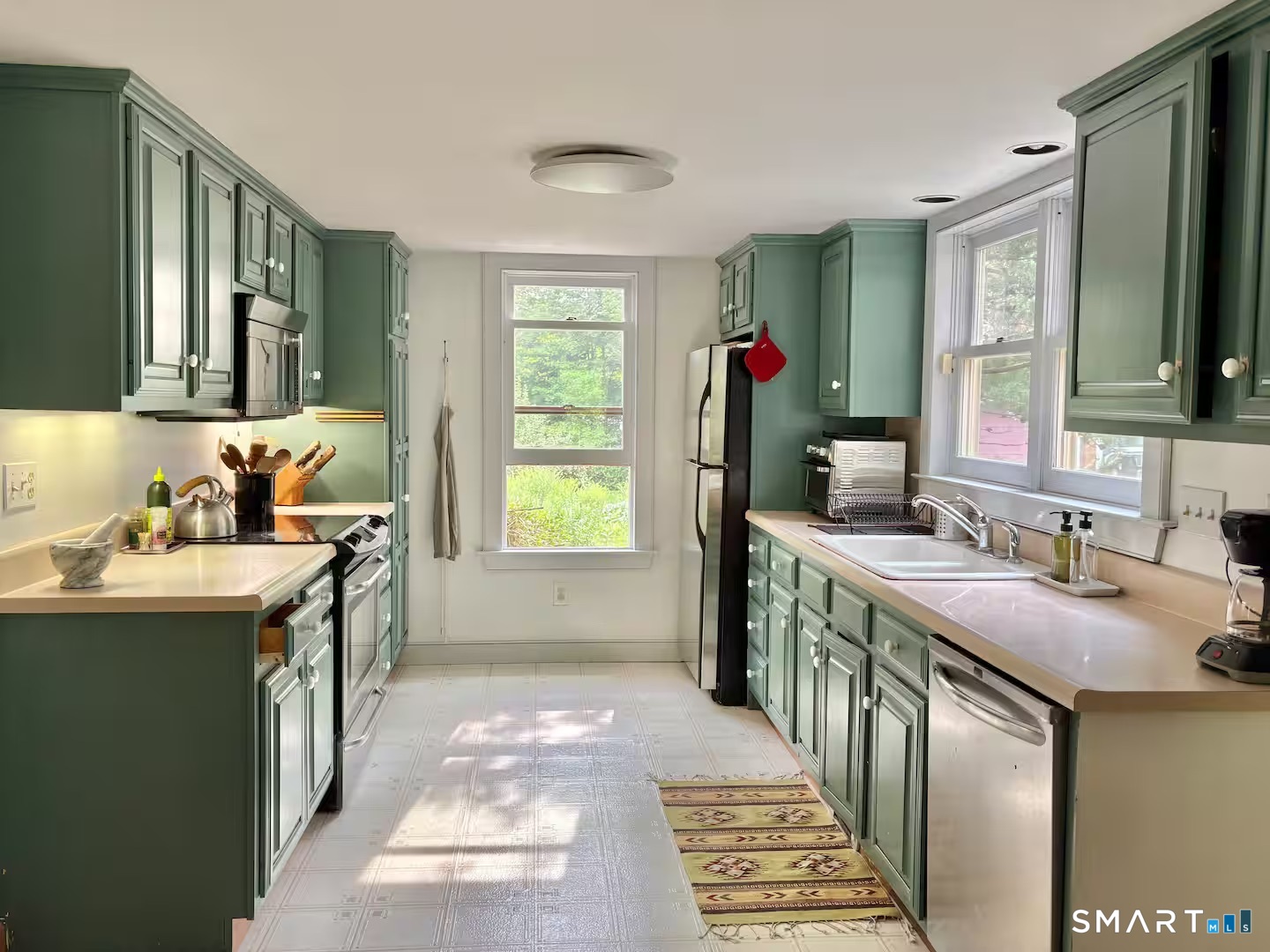 895 Tolland Stage Road Tolland, CT 06084 - Photo 2 of 33 a bathroom with a sink double vanity granite and a mirror