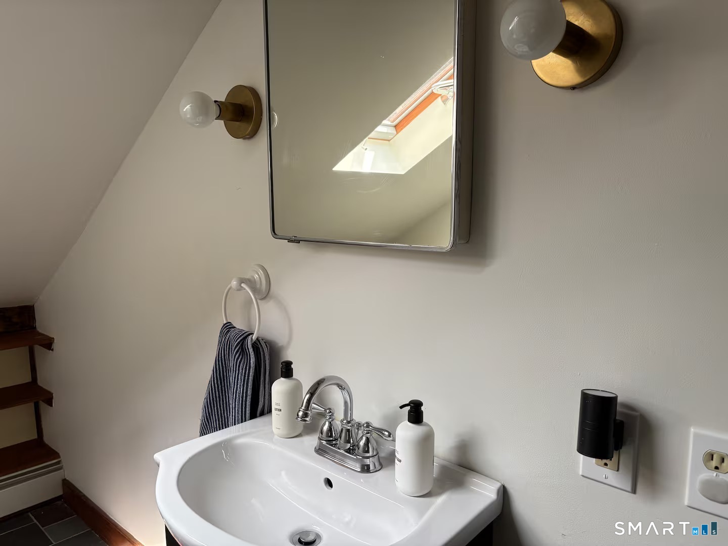 895 Tolland Stage Road Tolland, CT 06084 - Photo 25 of 33 a bathroom with a sink and a mirror