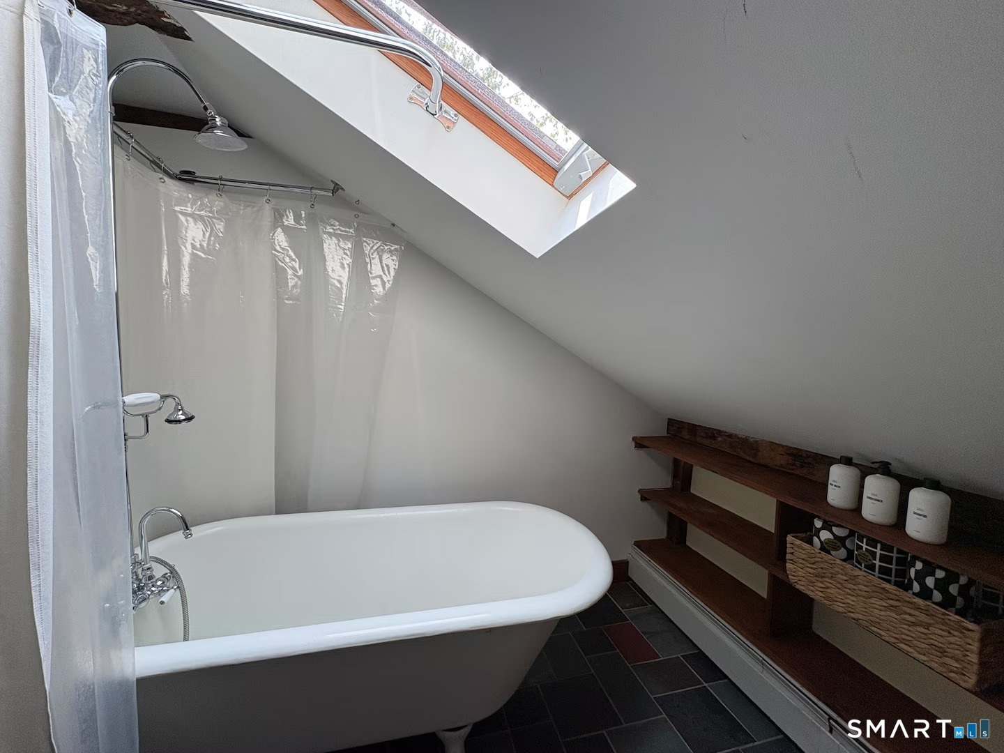 895 Tolland Stage Road Tolland, CT 06084 - Photo 26 of 33 a bathroom with a white bathtub