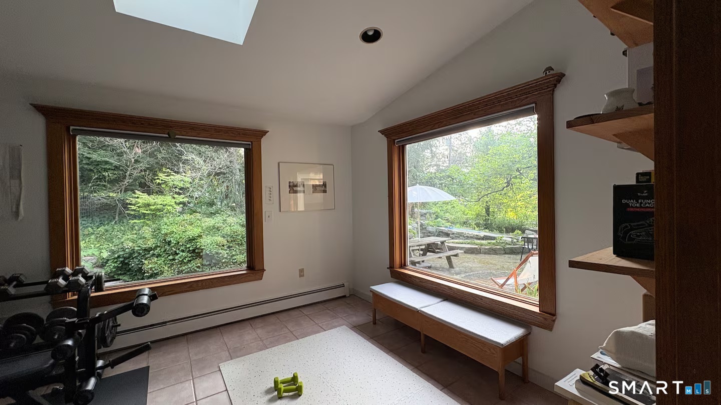 895 Tolland Stage Road Tolland, CT 06084 - Photo 28 of 33 a living room with a large window
