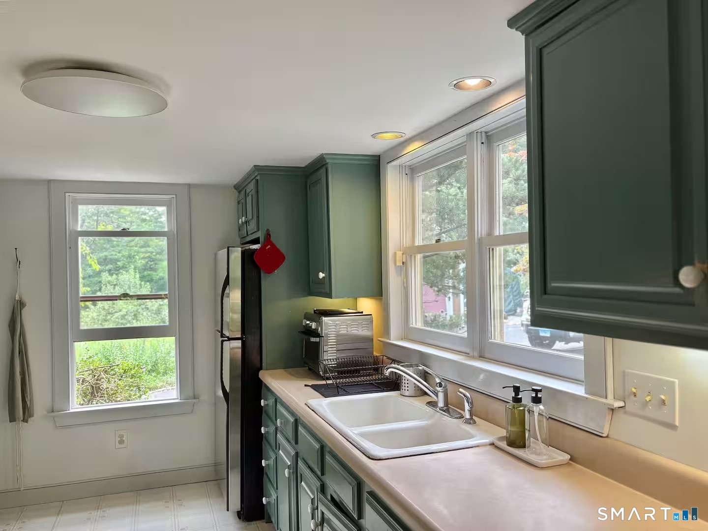 895 Tolland Stage Road Tolland, CT 06084 - Photo 3 of 33 a bathroom with a sink and a window