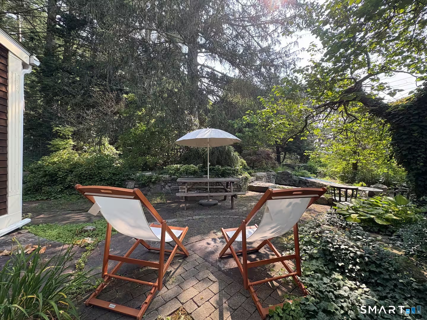 895 Tolland Stage Road Tolland, CT 06084 - Photo 31 of 33 a patio with glass top table and chairs