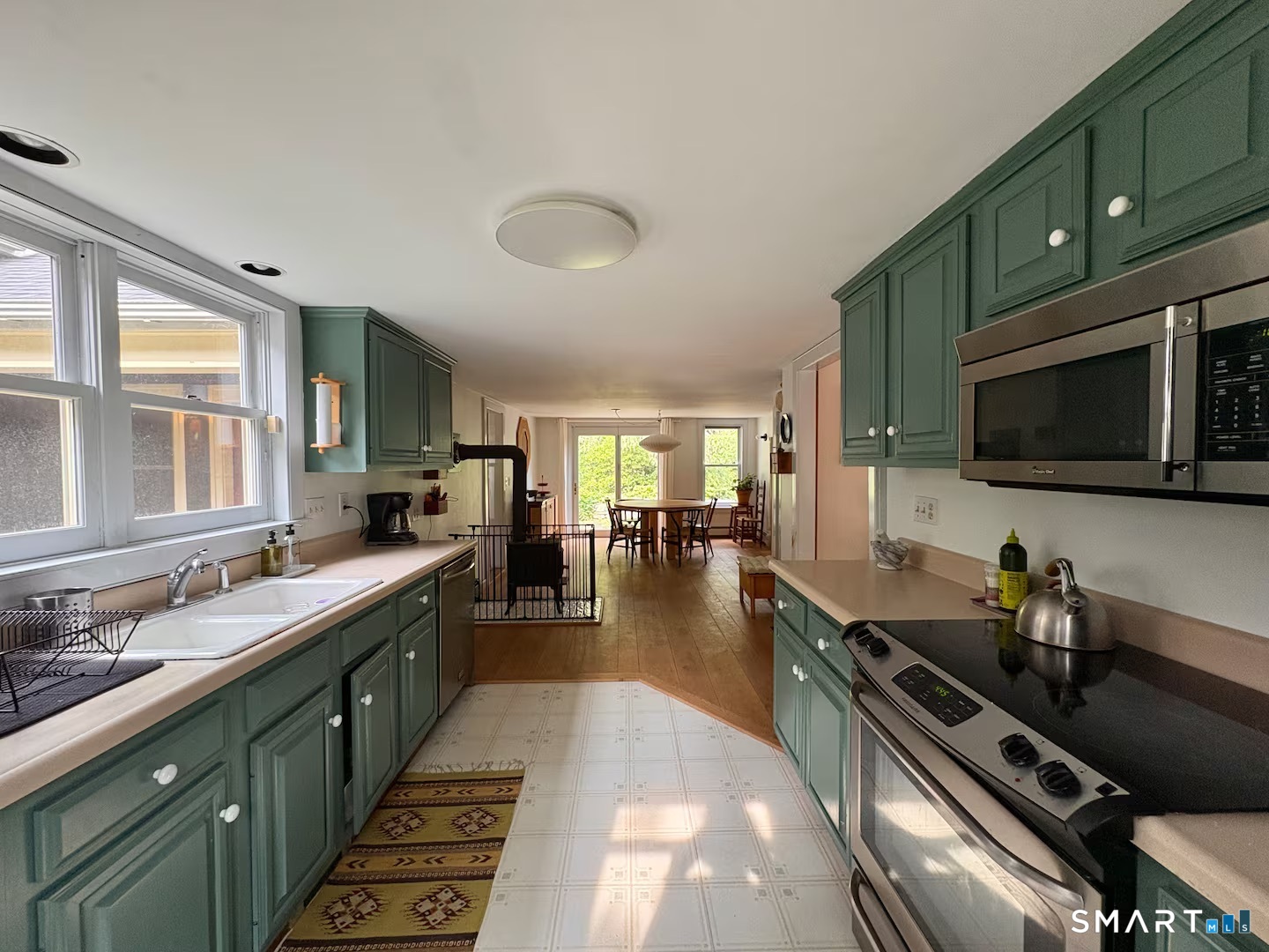 895 Tolland Stage Road Tolland, CT 06084 - Photo 5 of 33 a large kitchen with lots of counter space and stainless steel appliances