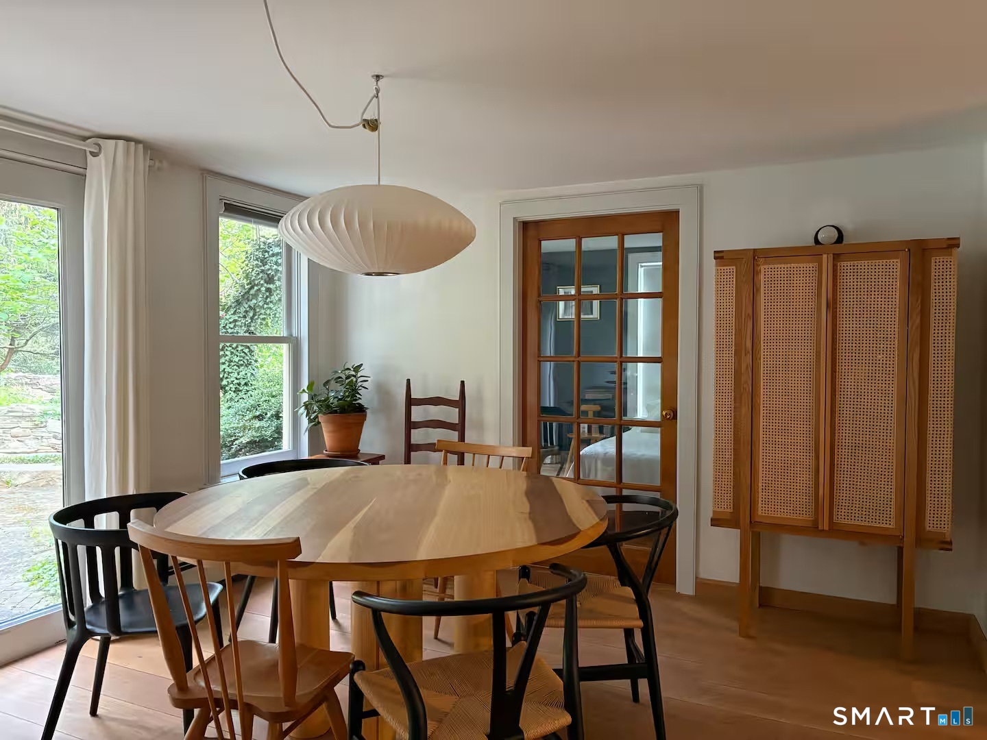 895 Tolland Stage Road Tolland, CT 06084 - Photo 6 of 33 a view of a dining room with furniture window and wooden floor