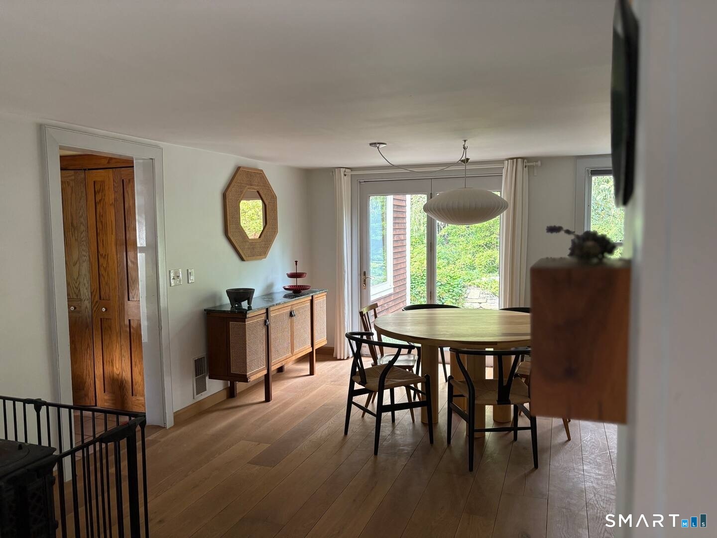 895 Tolland Stage Road Tolland, CT 06084 - Photo 7 of 33 a view of a dining room with furniture window and wooden floor