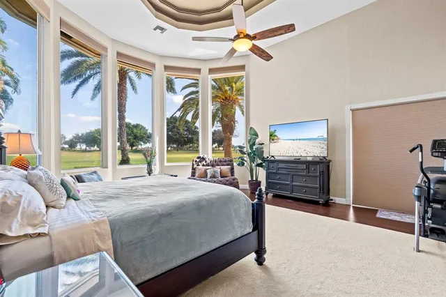 a room with furniture and large windows