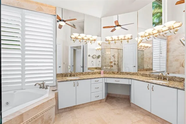 a view of a livingroom with furniture fire place and windows