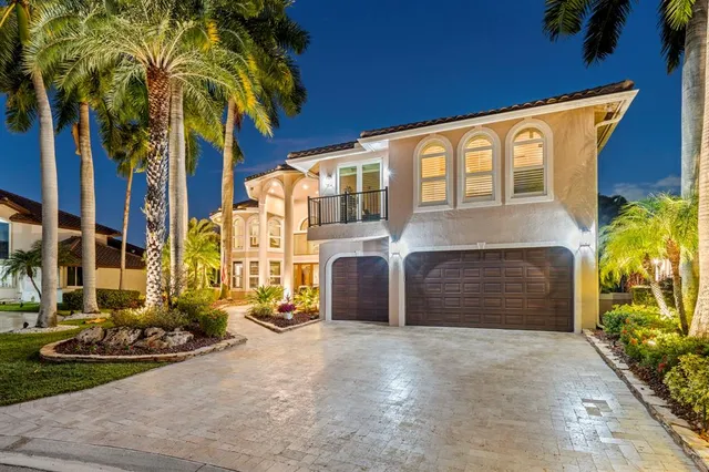 a view of a multi story building with a yard