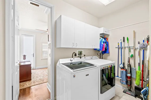 a bedroom with a bed window and a flat screen tv