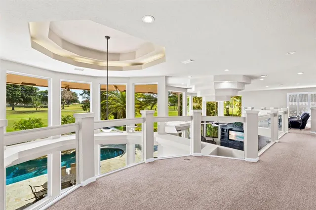 a view of a swimming pool with chairs