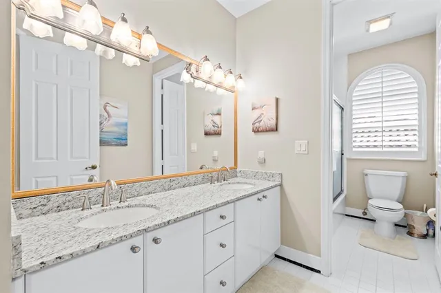 a view of a chair and table in the backyard