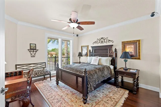 a front view of a house with a yard and palm trees