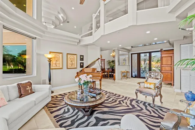 a large kitchen with stainless steel appliances granite countertop wooden cabinets a sink and dishwasher