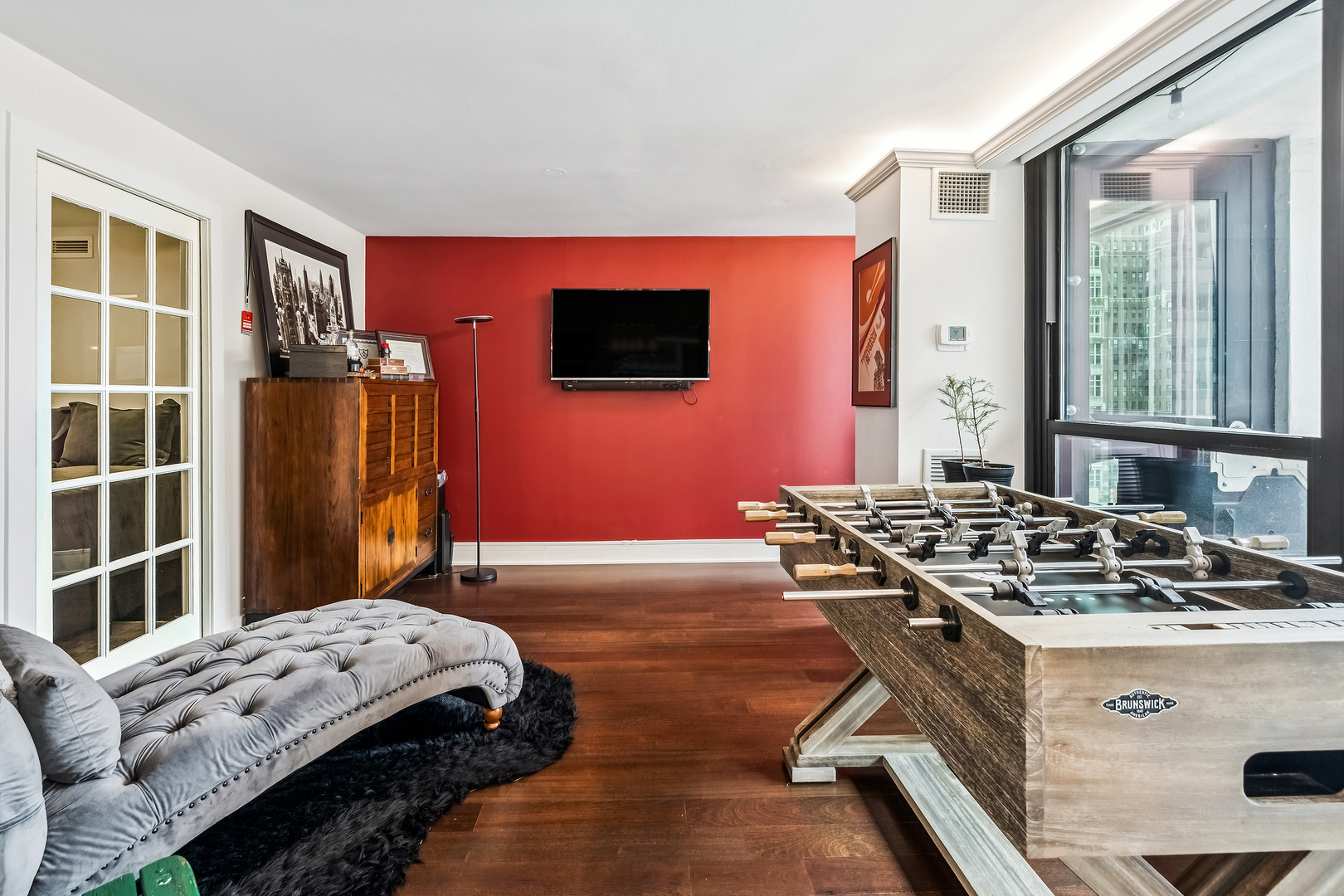 1030 North State Street, Unit 2GH Chicago, IL 60610 - Photo 17 of 36 a bedroom with a bed and a flat screen tv