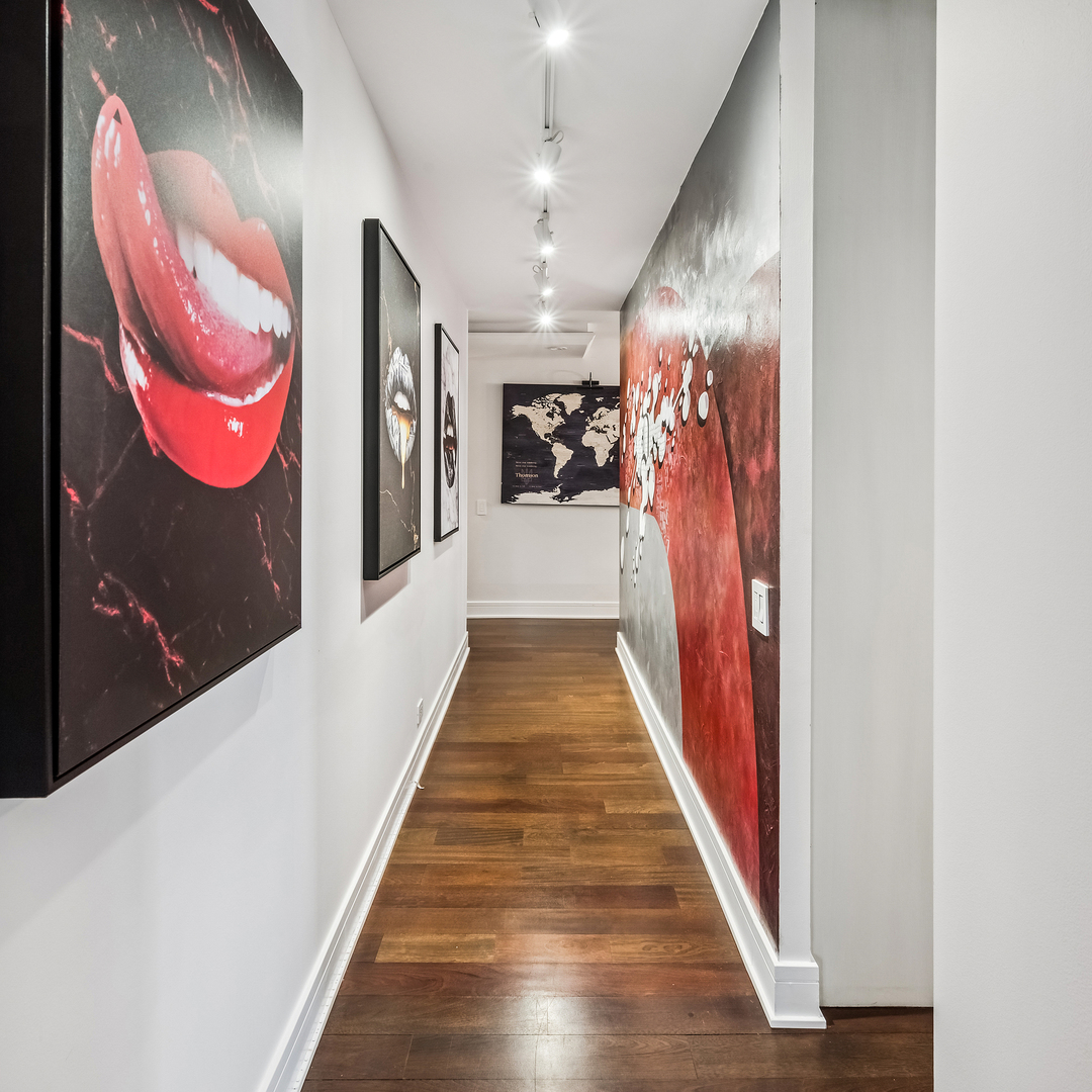 1030 North State Street, Unit 2GH Chicago, IL 60610 - Photo 18 of 36 a view of a hallway with wooden floor