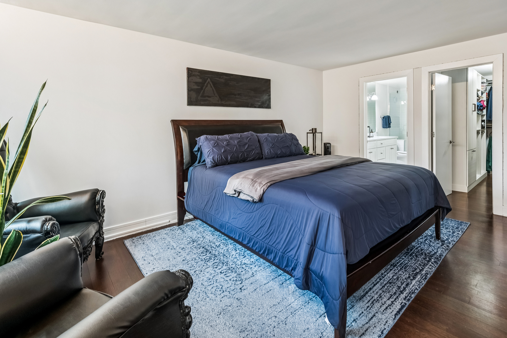 1030 North State Street, Unit 2GH Chicago, IL 60610 - Photo 19 of 36 a bedroom with a bed and wooden floor