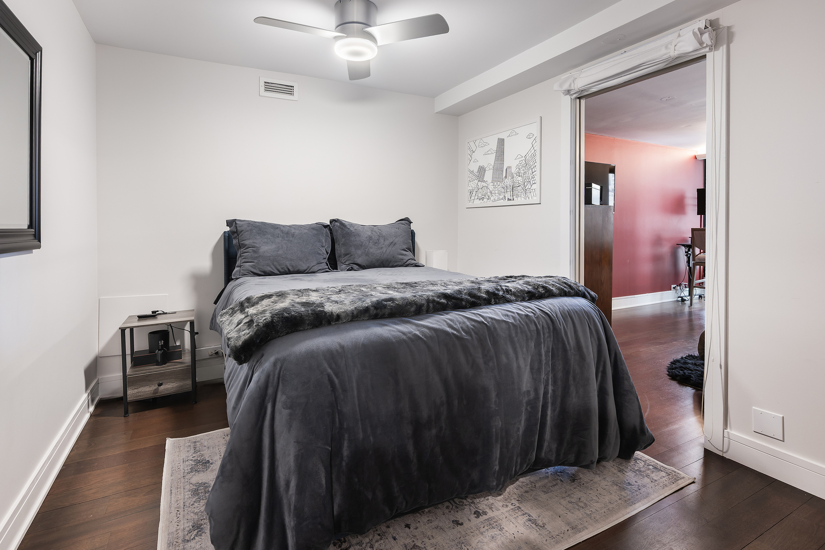 1030 North State Street, Unit 2GH Chicago, IL 60610 - Photo 24 of 36 a bedroom with a bed and a view of kitchen