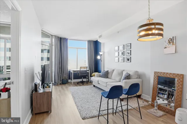 a living room with fireplace furniture and a window
