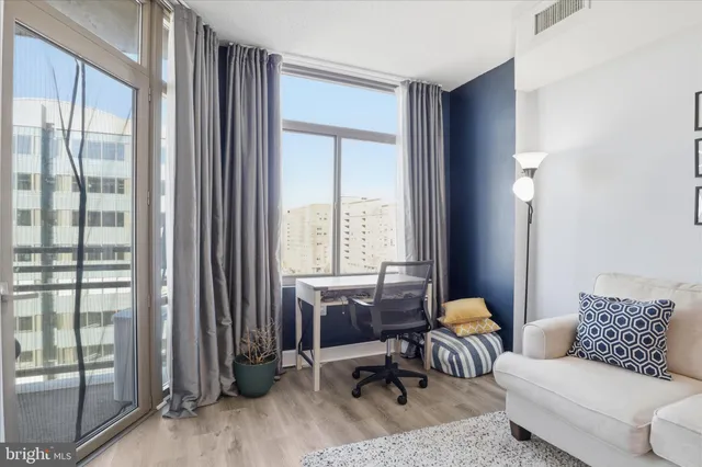 a living room with furniture and a window