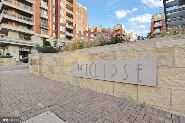 a street sign on a wall next to building