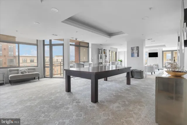 a large kitchen with a table and chairs