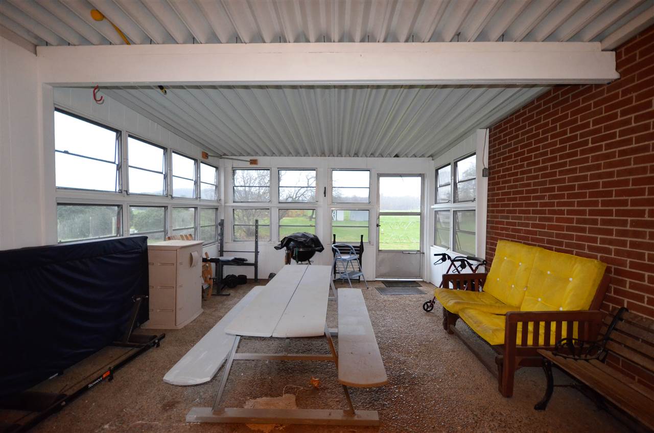 436 Mt Torrey Road Lyndhurst, VA 22952 - Photo 8 of 29 Multi purpose room becomes screen porch for Summer months. Entrance from carport has separate storage room with freezer that conveys. Convenient entrance to family room and garage.