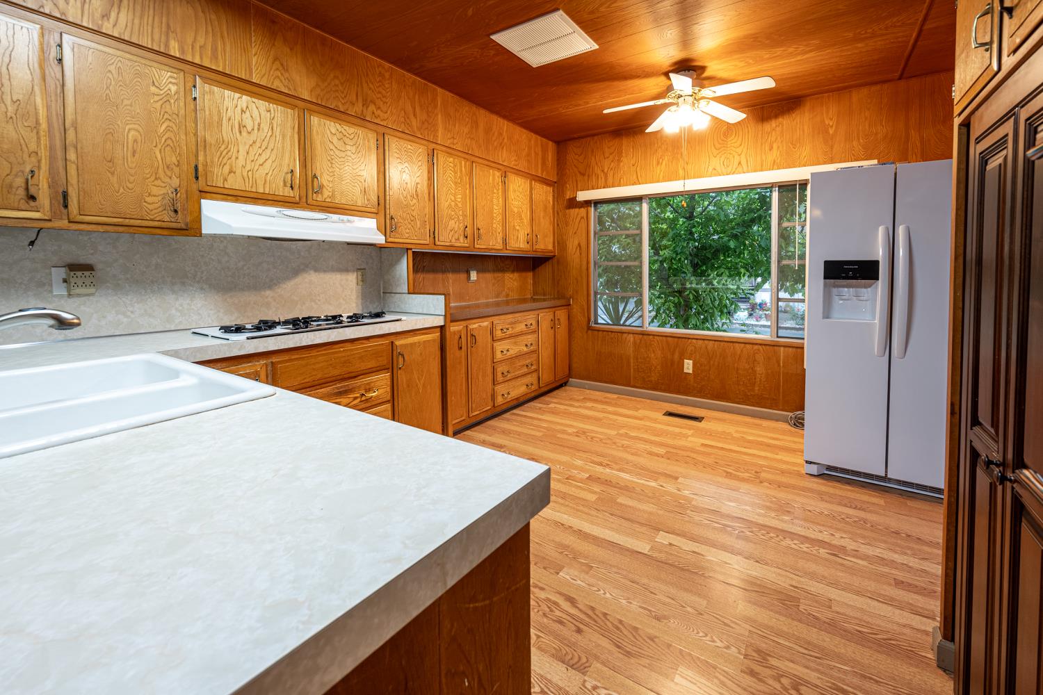 9060 Auburn Folsom Road, Unit 1 Granite Bay, CA 95746 - Photo 13 of 27 a kitchen with stainless steel appliances granite countertop a sink a stove and a refrigerator