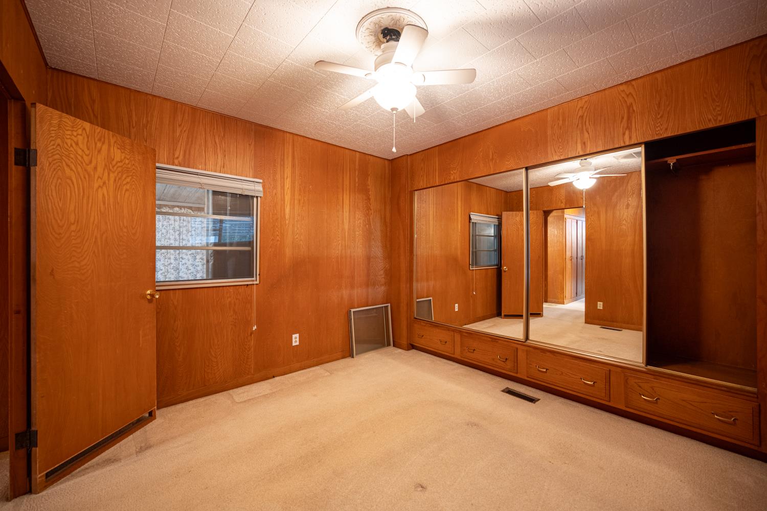 9060 Auburn Folsom Road, Unit 1 Granite Bay, CA 95746 - Photo 19 of 27 a view of an empty room with a chandelier fan