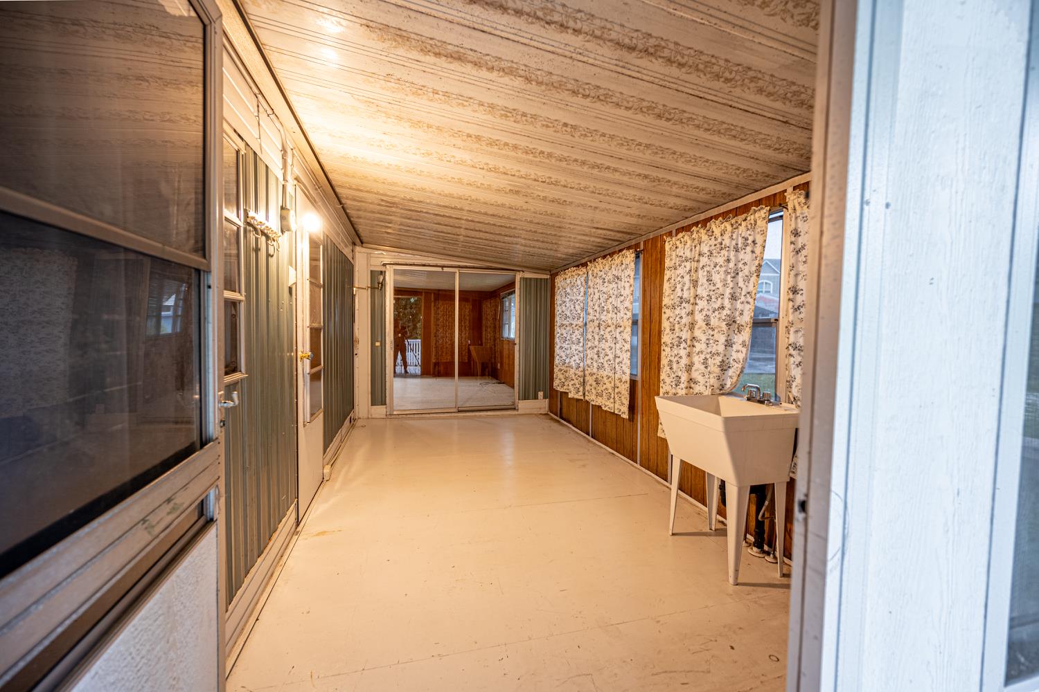 9060 Auburn Folsom Road, Unit 1 Granite Bay, CA 95746 - Photo 20 of 27 a view of a hallway with a large window