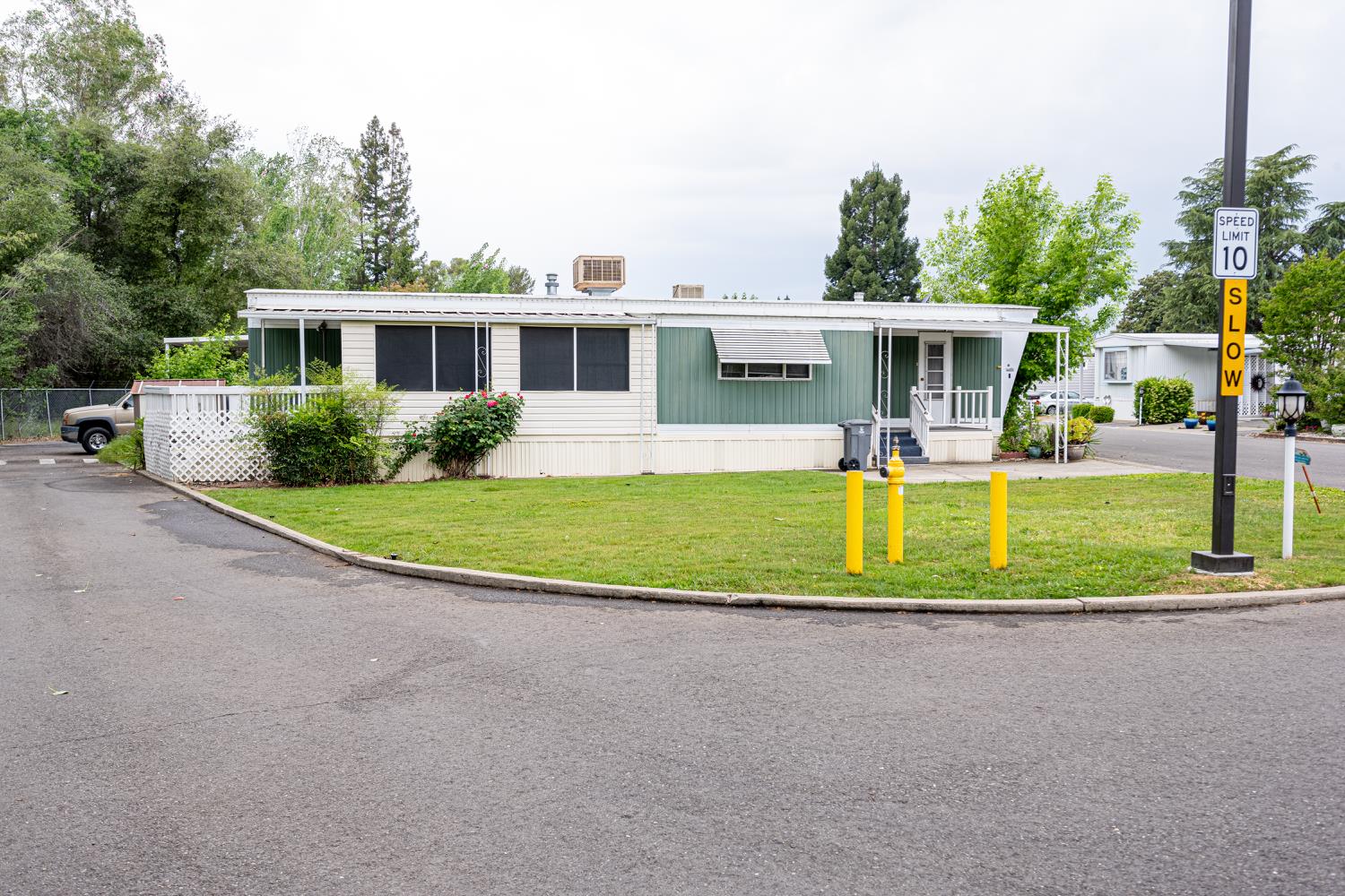 9060 Auburn Folsom Road, Unit 1 Granite Bay, CA 95746 - Photo 2 of 27 a view of a house with a big yard and potted plants
