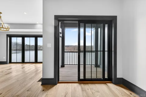 a view of a large window with wooden floor