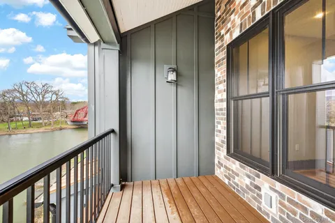 a view of a balcony with wooden floor