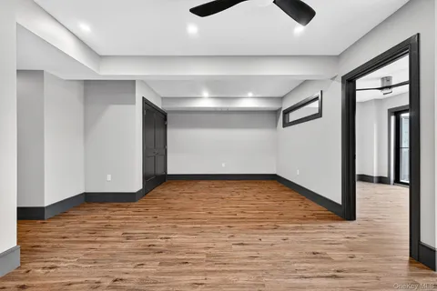 a view of a room with wooden floor
