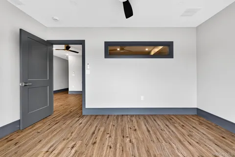 a view of a livingroom with wooden floor