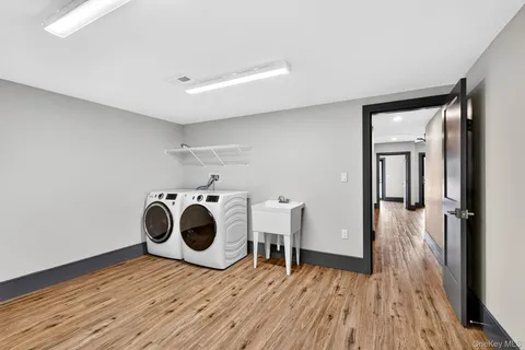 a view of a room with wooden floor