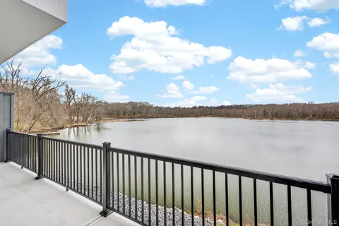 a balcony with lake view