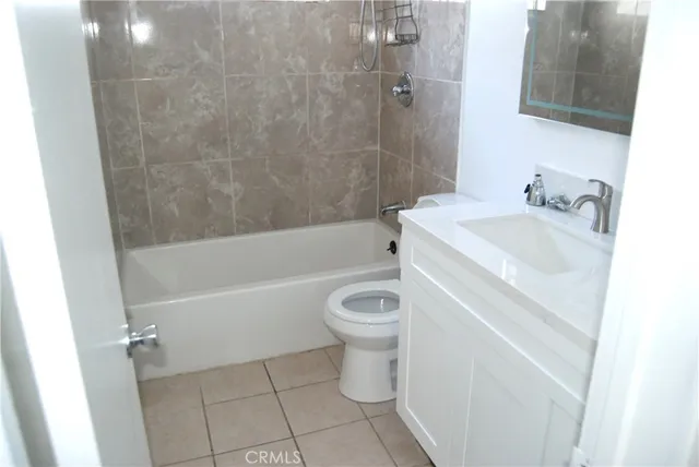 a bathroom with a sink toilet and bathtub