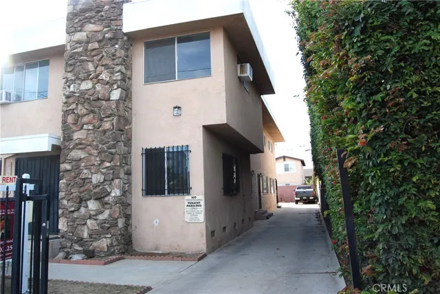 a view of a house with a tree