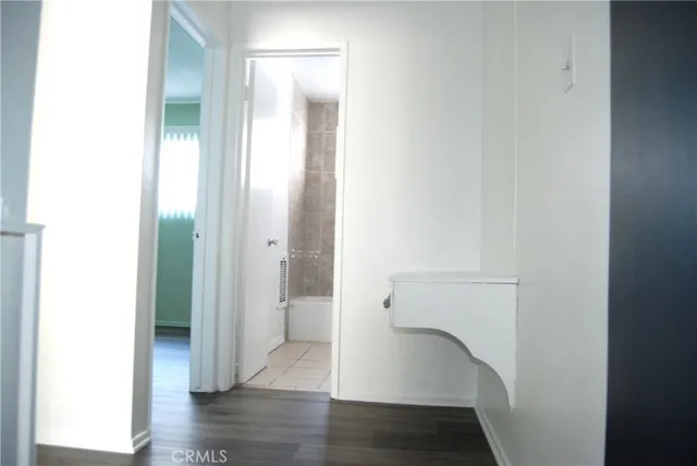 a view of an entryway with wooden floor