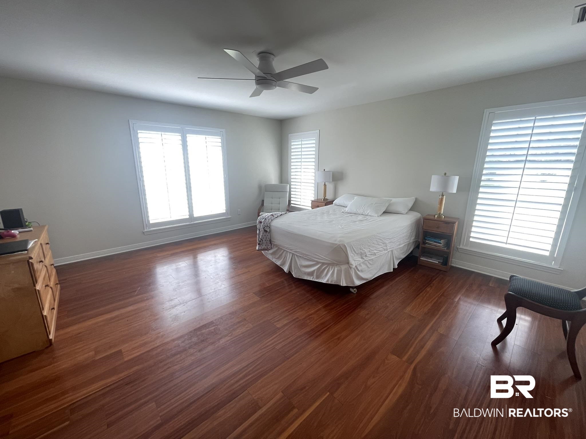 35405 Pine Road South Stapleton, AL 36578 - Photo 13 of 29 Bedroom featuring dark wood-style flooring and a ceiling fan