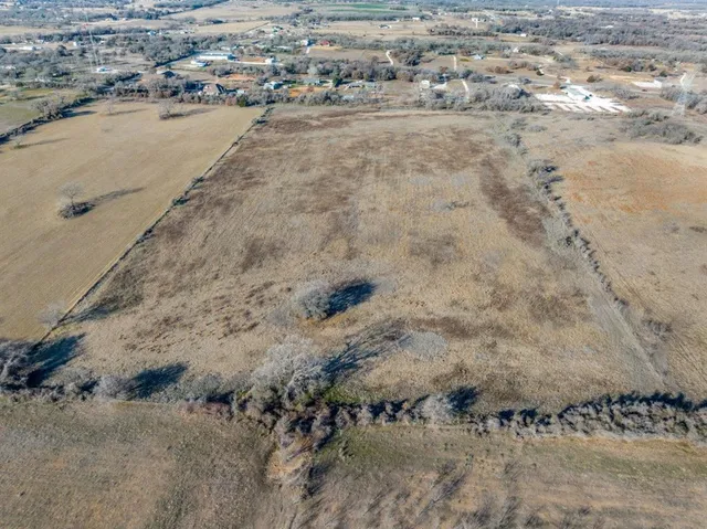 a view of a swimming pool with a yard