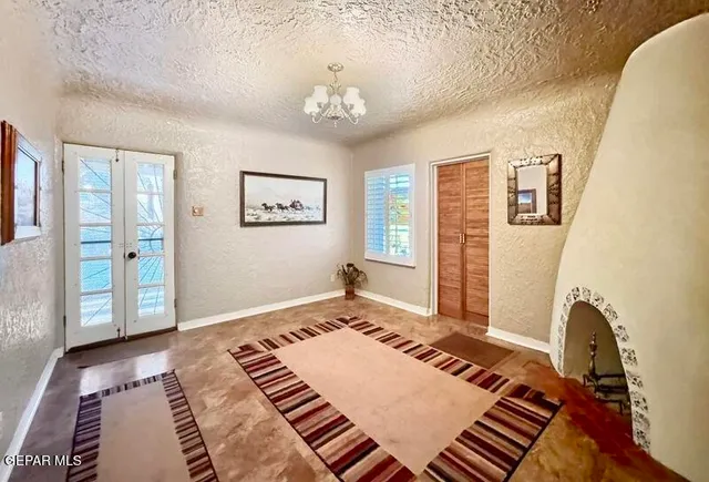 a bedroom with furniture and window
